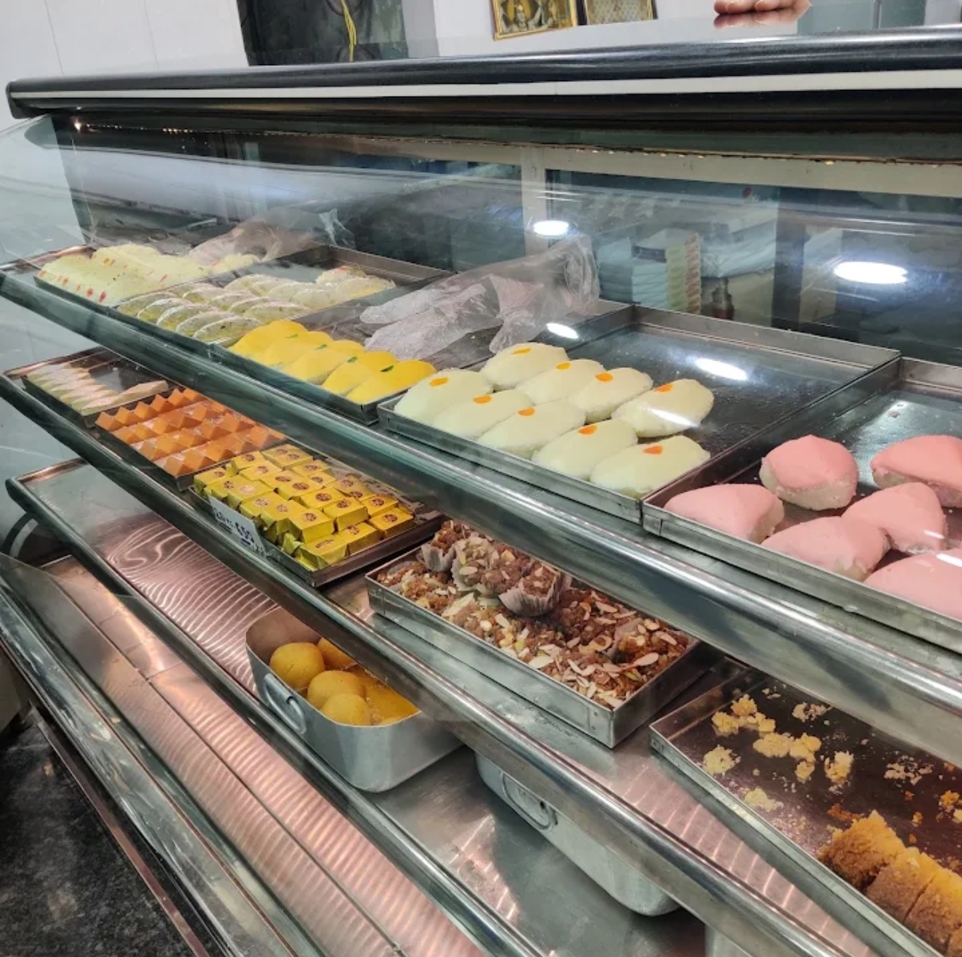 Fresh sweets and food being prepared at Ananda Bhandar